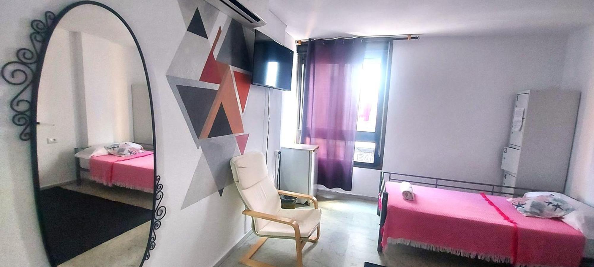 Camera Doppia con Letti Singoli e Bagno in Comune