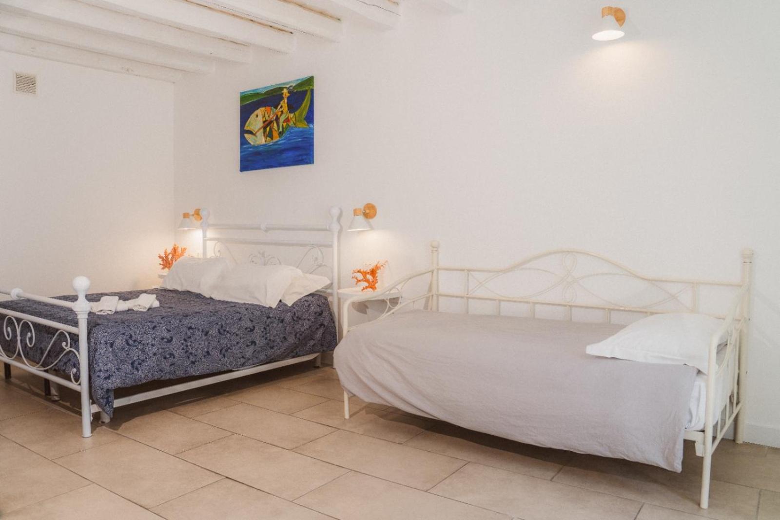 Camera Matrimoniale/Doppia con Letti Singoli con Letto Supplementare