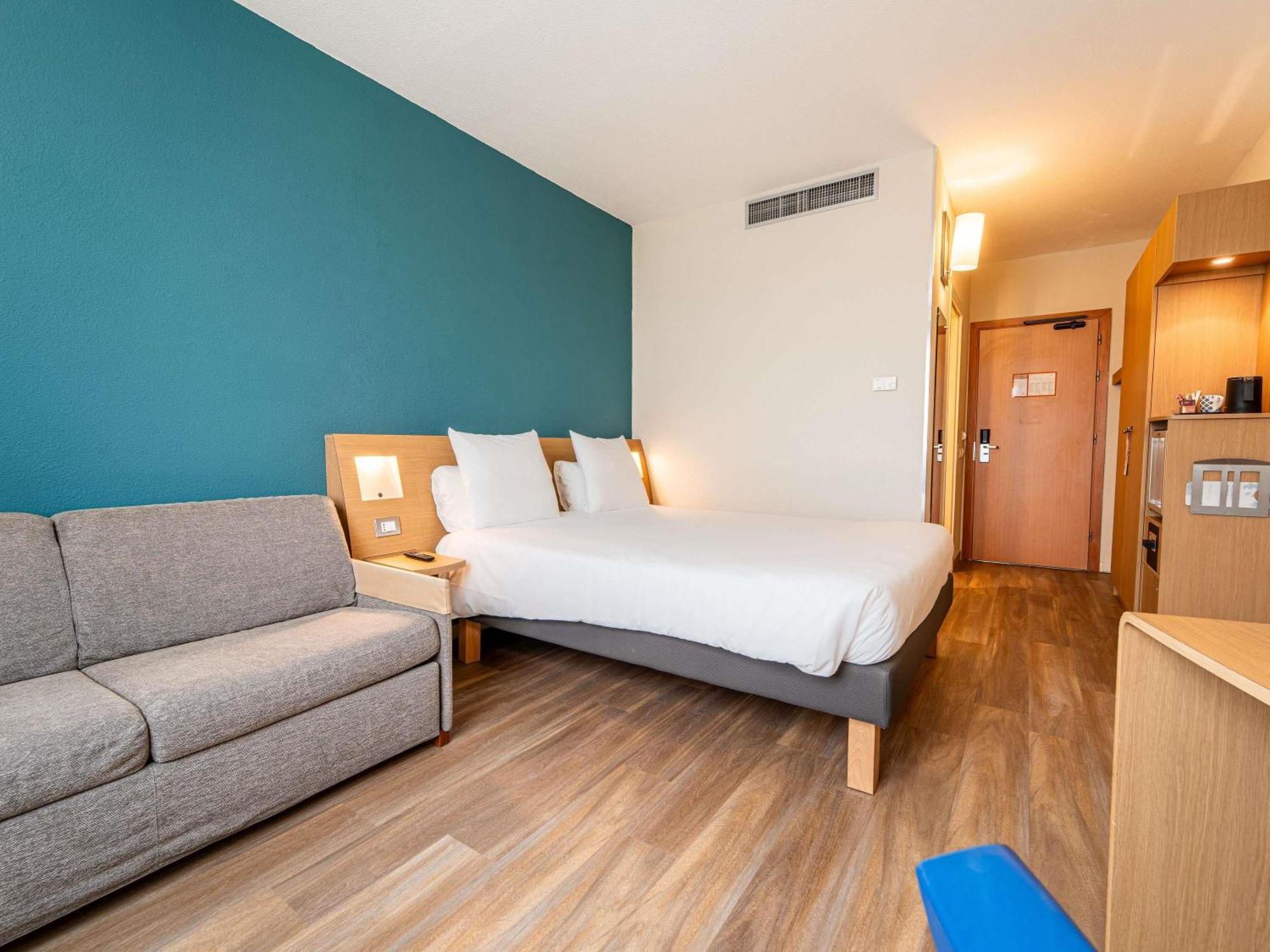 Camera Matrimoniale Executive con Divano-Letto